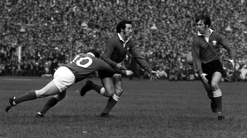 Sir Gareth Edwards (centre) and Barry John (right) in action for Wales