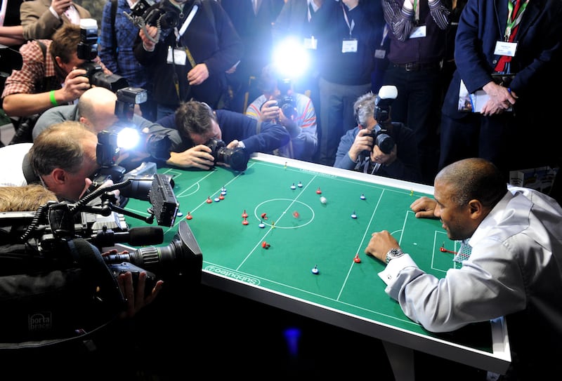 John Barnes playing Subbuteo in front of cameras