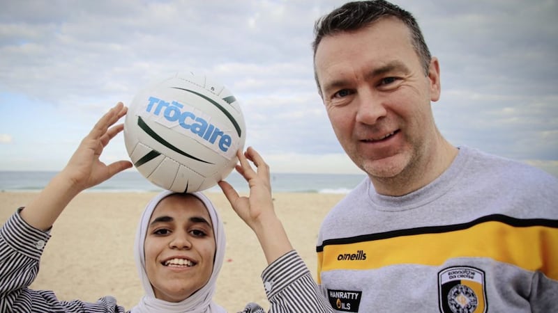 Two years after travelling to Gaza with Tr&oacute;caire to see the plight of Palestinians at first hand, Armagh&#39;s All-Ireland winner Ois&iacute;n McConville launches the charity&#39;s Christmas Appeal for 2021 in support of women and girls in the war-torn region. He is pictured with Hala Sanak who plays for Gaza&rsquo;s first-ever schoolgirls&#39; soccer club. The 14-year-old&#39;s team received a Gaelic football skills session on Gaza beach during his trip. Picture by Garry Walsh, Tr&oacute;caire 