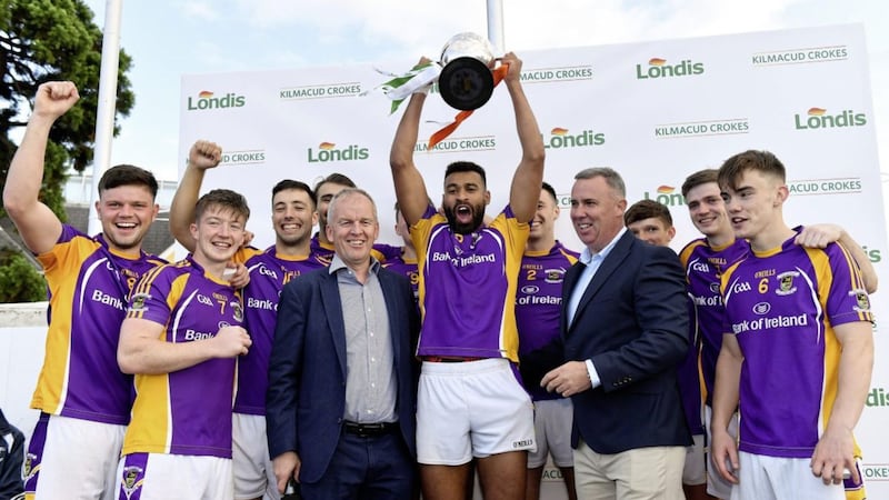 Kilmacud Crokes captain Karl Dias lifts the Londis Senior All-Ireland Football 7s cup alongside Conor Hayes, Londis Sales Director, right, and Pat Horgan, Chairman of Kilmacud Crokes Football, after beating An R&iacute;ocht, Co Down, in the final of the Londis Senior All-Ireland Football 7s at Kilmacud Crokes GAA Club in Stillorgan, Co Dublin on Saturday August 31 2019. Picture by Piaras &Oacute; M&iacute;dheach/Sportsfile 