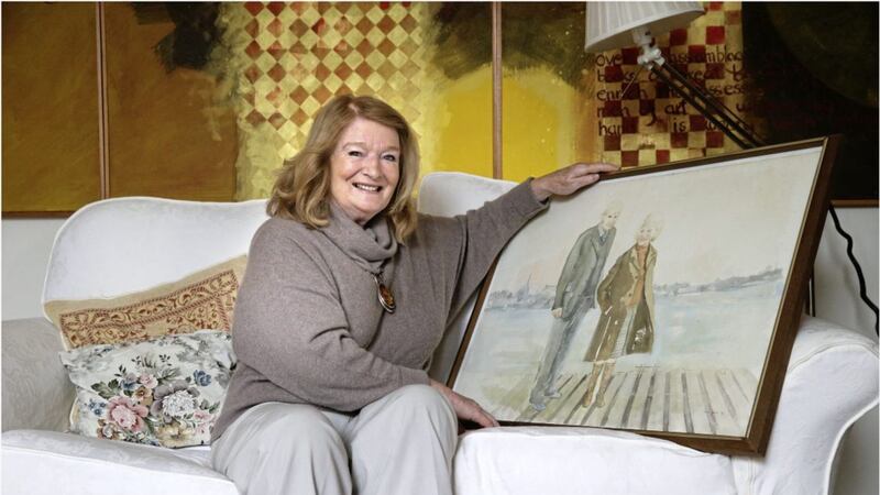 Artist Denise Ferran with her watercolour of her parents John and Kathleen Devine Picture: Hugh Russell 