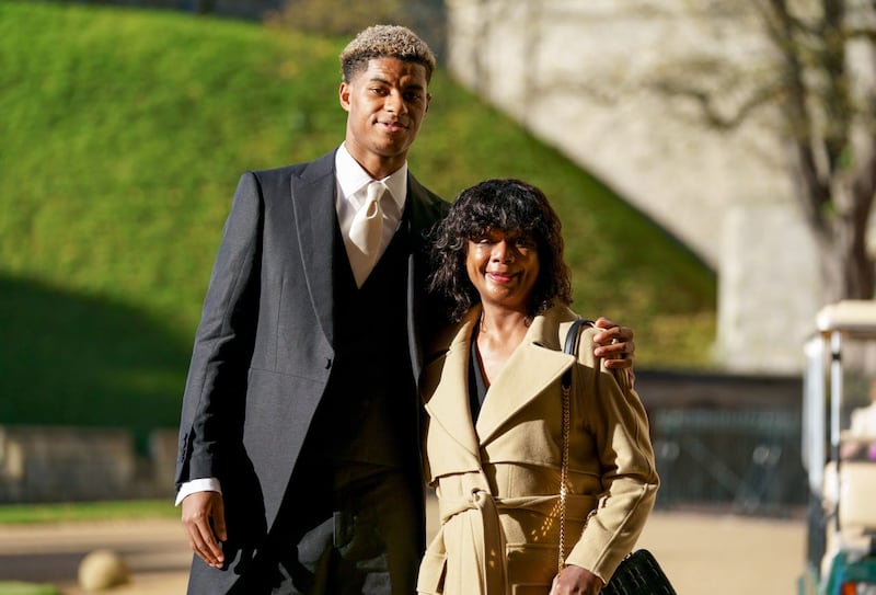 Footballer Marcus Rashford with his mother Melanie Rashford before receiving his MBE for services to vulnerable children in the UK during Covid-19 during an investiture ceremony at Windsor Castle