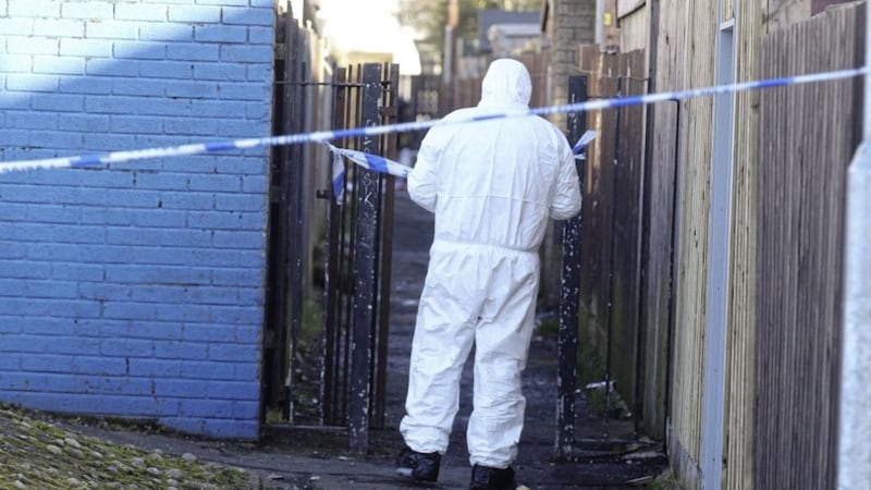 Forensic officers at the scene of the shooting at Hopewell Crescent in the lower Shankill Road area of Belfast. Picture by Hugh Russell 