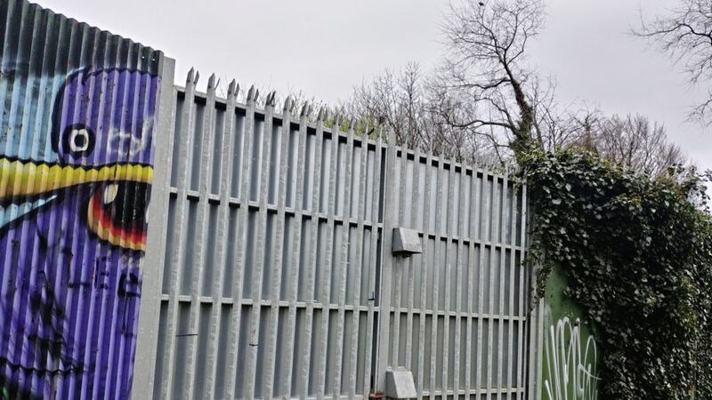 A peace wall gate dividing Alexandra Park in north Belfast 