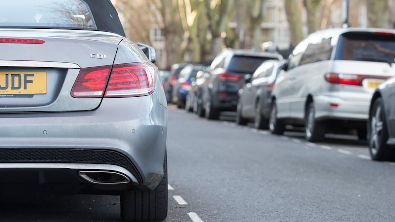 Embargoed until 0001 Thursday 30 May File photo dated 16/01/16 of cars parked on a residential street in London. National guidelines for sharing parking data will make it easier for drivers to find a space, the Department for Transport (DfT) has claimed.