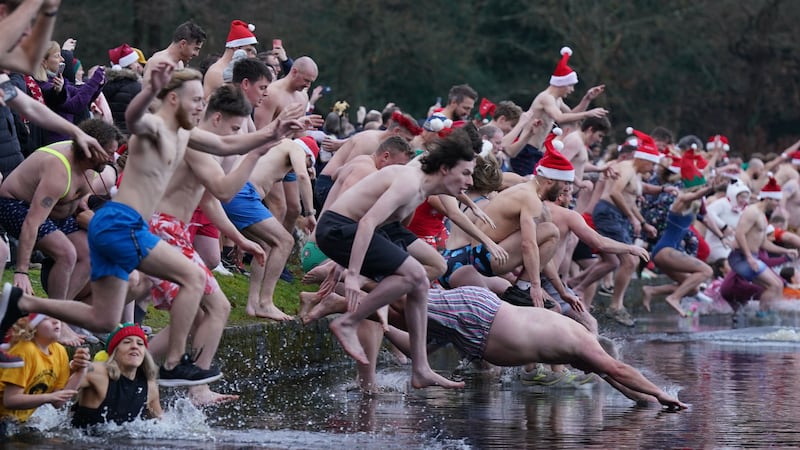 Many donned festive hats and costumes as they took to lakes, ponds and the seas around the UK.