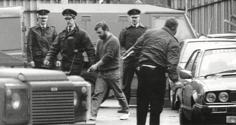 Alex Murphy led into Belfast magistrates court charged over the murders of corporals Derek Wood and David Howes 