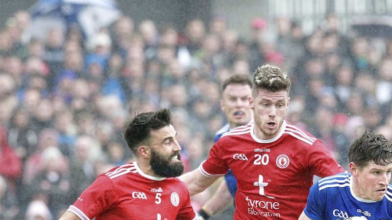 Darren Hughes tangles with Tyrone&#39;s Tiernan McCann and Declan McClure during the Ulster Senior Football Championship quarter-final at Healy Park. Picture Margaret McLaughlin. 