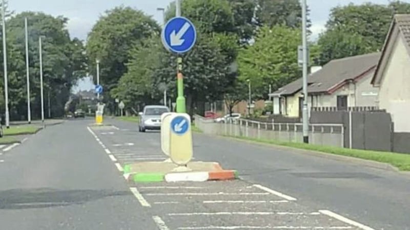 The kerbstones in Limavady painted green, white and orange. Pictures from BBC 