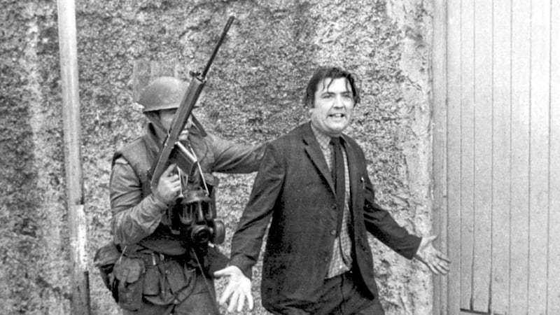 John Hume is detained by soldiers during a civil rights protest in Derry in August 1971: Alan Lewis - PhotopressBelfast.co.uk 