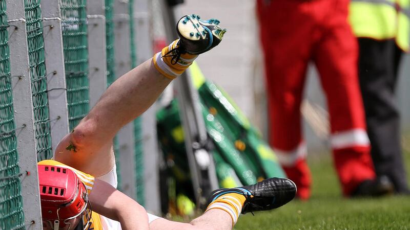 Antrim&#39;s Conor McCann is sent crashing against the perimeter fence during the Saffrons&#39; defeat to Carlow at Dr Cullen Park Picture: John McIlwaine 