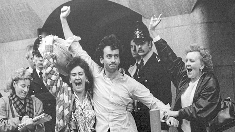 Flanked by his sisters, Gerry Conlon emerges from the Old Bailey in London after the Guildford Four&#39;s convictions were quashed in October 1989 