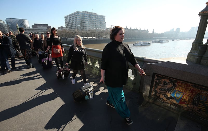 Derry Girls cast members Siobhan McSweeney (right) and Nicola Coughlan join women impacted by Northern Ireland's strict abortion laws who are carrying suitcases, symbolising the women who travel from Northern Ireland to Great Britain for terminations, across Westminster Bridge demanding legislative change&nbsp;
