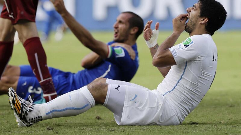 Luis Suarez bites Giorgio Chiellini in the 2014 World Cup