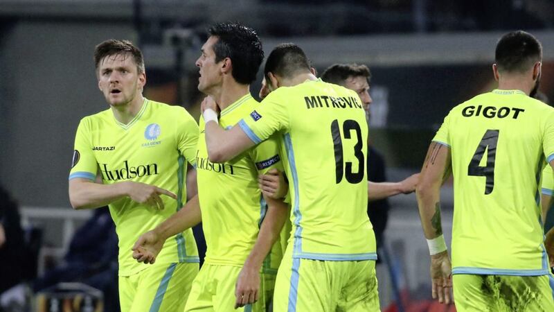 Gent&#39;s Jeremy Perbet, second from left, celebrates with his team-mates after scoring the winning goal against Spurs 