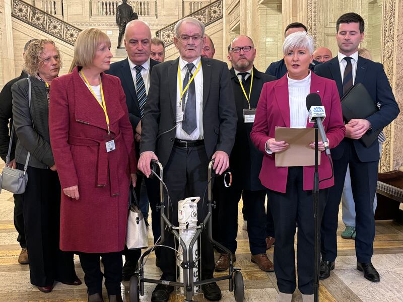 Survivor of the Kingsmill massacre Alan Black, pictured centre