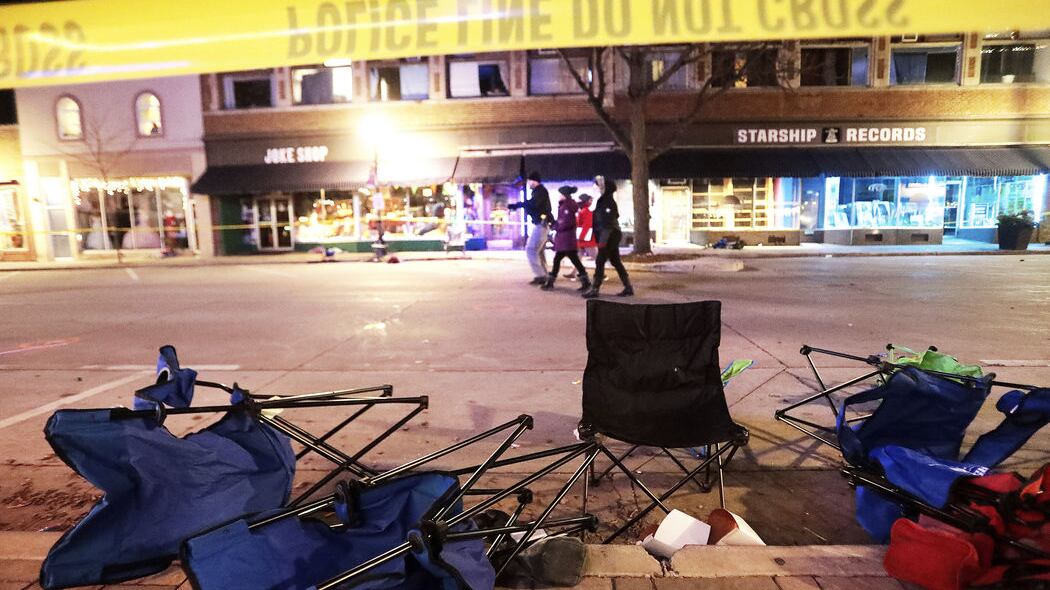 Toppled chairs line W Main St in downtown Waukesha, Wis. after an SUV drove into a parade of Christmas marchers Sunday, November 21, 2021 (John Hart/Wisconsin State Journal via AP)&nbsp;