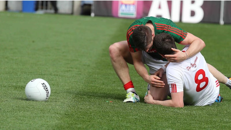 Mayo's Lee Keegan consoles Tyrone's Colm Cavanagh at the end of the game&nbsp;