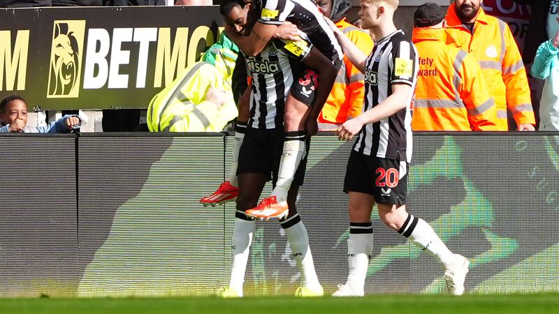 Alexander Isak (left) celebrates scoring Newcastle’s third goal
