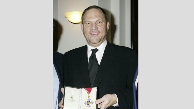 Harvey Weinstein after being awarded his CBE, Commander of the British Empire, in 2004 Picture: PA 