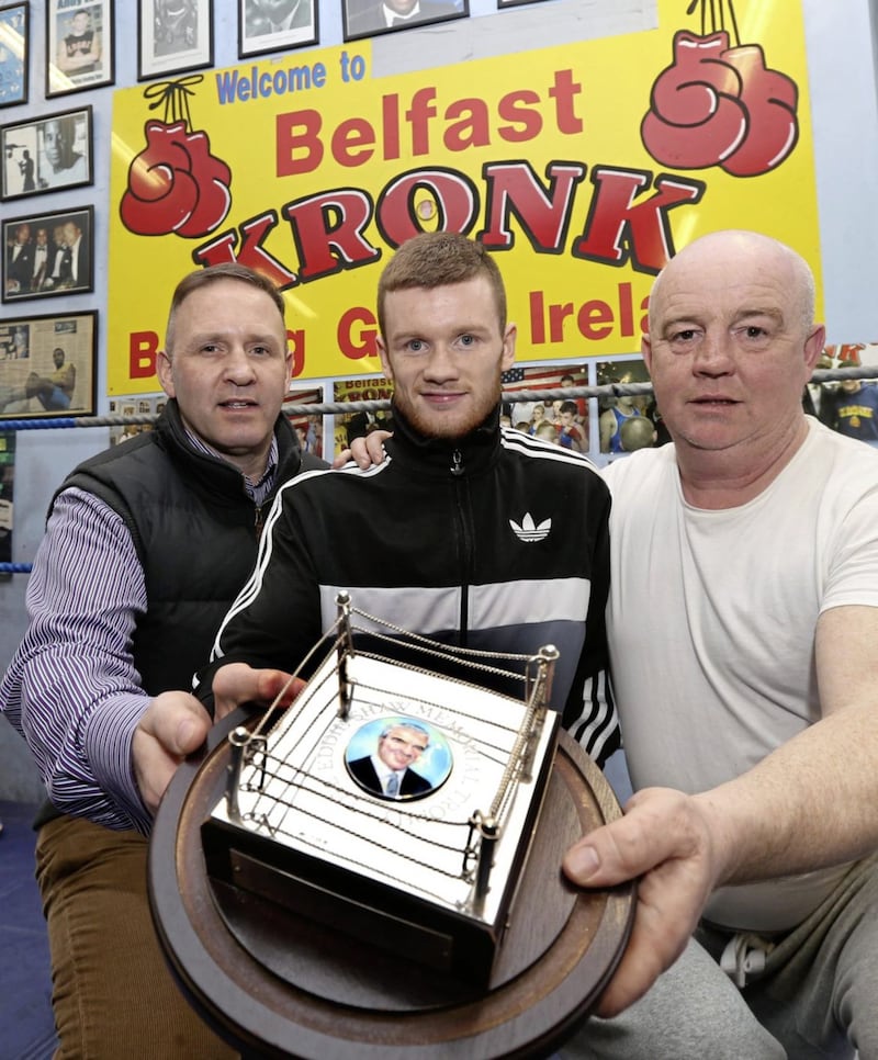 James Tennyson pictured with the BBB of C Northern Ireland Area Council Eddie Shaw Memorial Trophy for the best Northern Ireland Boxer with Mark Dunlop (left) and Tony Dunlop (right). Pic Hugh Russell. 