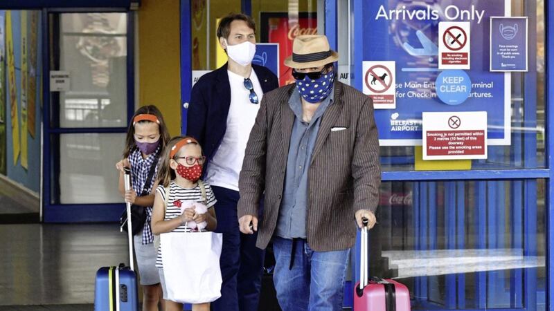 Passengers arriving from Alicante into Belfast International Airport last month a day after being told they would be required to quarantine for 14 days on arrival home. Picture by Alan Lewis/Photopress 