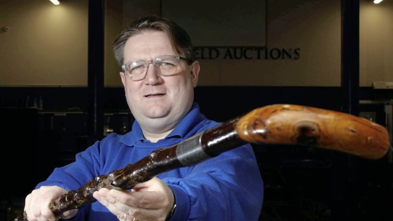 Karl Bennett, managing director of Bloomfield Auctions in east Belfast, with a walking stick belonging to Northern Ireland&rsquo;s first Prime Minister, James Craig 