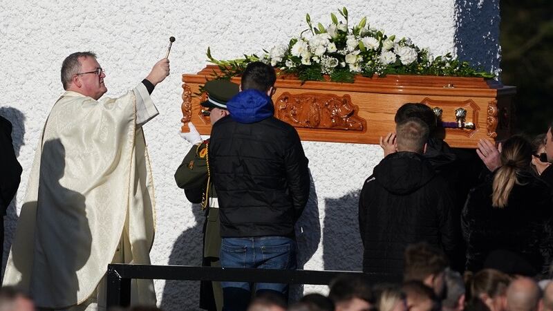 Father John Joe Duffy blesses the coffin of Martina Martin as it arrives at St Michael's Church, in Creeslough, for the funeral mass of the 49-year-old mother who died following an explosion at the Applegreen service station in the village of Creeslough in Co Donegal. Picture by Brian Lawless, PA