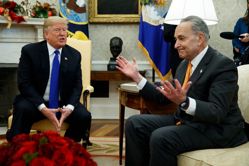 President Donald Trump talks with Senate Minority Leader Chuck Schumer, D-N.Y., during a meeting in the Oval Office of the White House