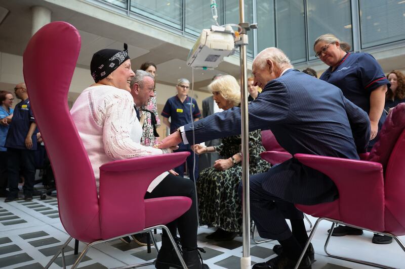 The King and Queen meet cancer patient Lesley Woodbridge undergoing chemotherapy in the day unit and her husband Roger