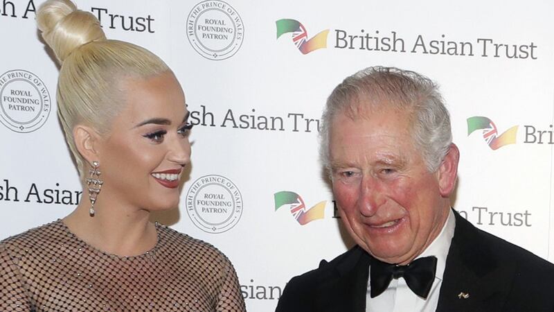 The Roar and Firework singer joined Charles and the Duchess of Cornwall at a black tie reception.