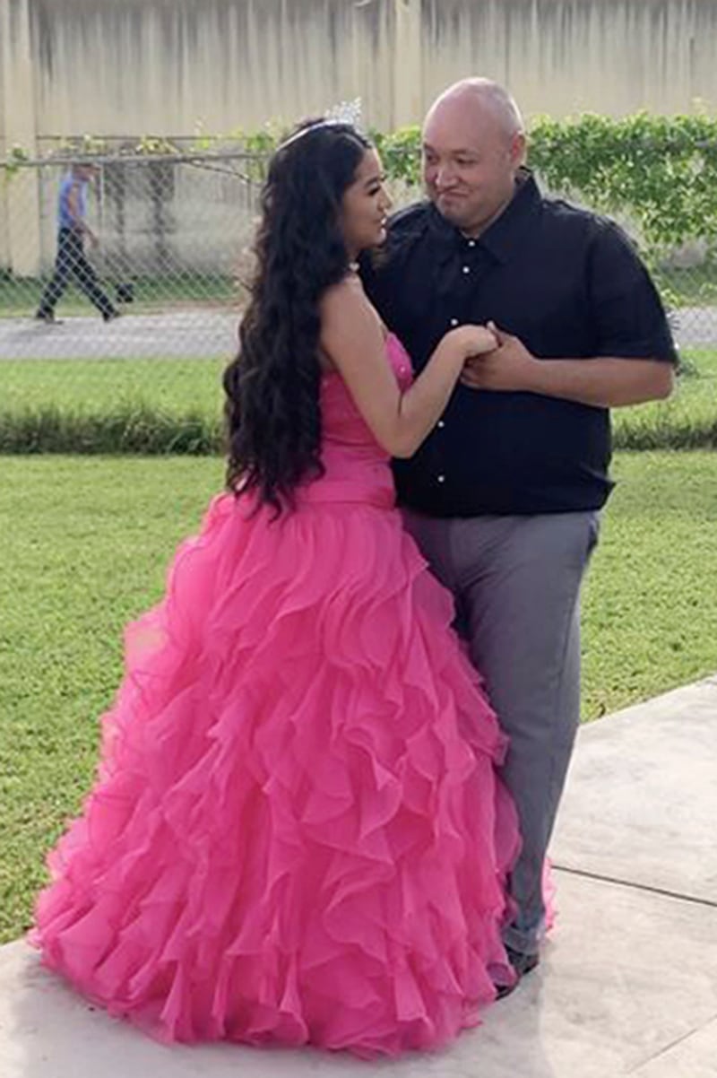 Adriana Palma wears a tiara and ballgown as she dances with her father, Noe Ramirez Huerta, on her quinceanera, her 15th birthday celebration 