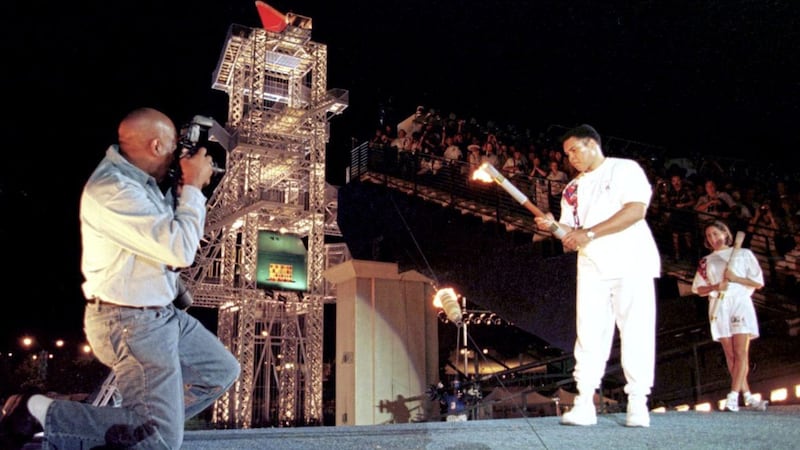 American swimmer Janet Evans waits in the wings as Muhammad Ali lights the Olympic cauldron at the opening ceremony of the 1996 Olympic Games in Atlanta. Picture by PA 