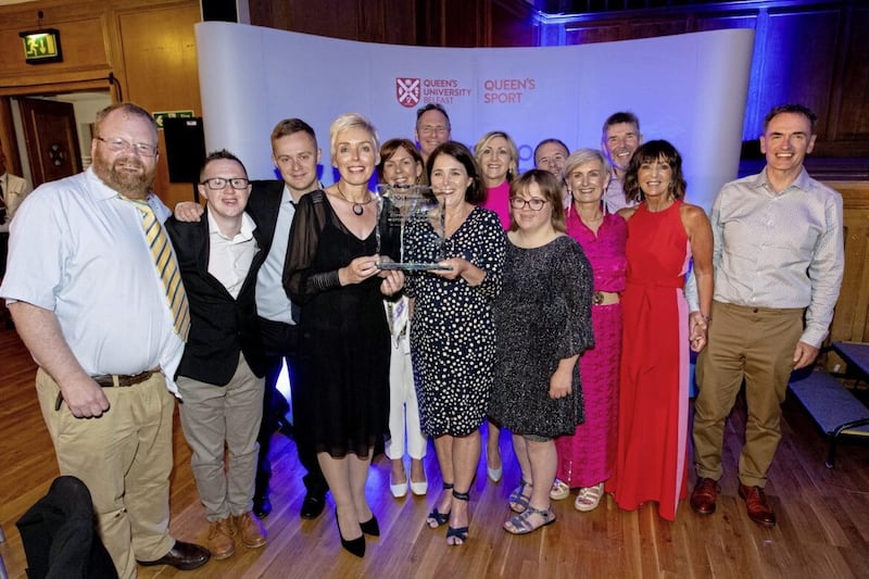 Members of the South Belfast Parkrun celebrate after being recognised at the Queen&#39;s University Sports Awards. 