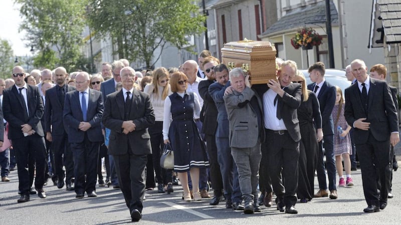 Family members carry Paddy Joe McClean&#39;s coffin the short distance from his home to the Church of the Immaculate Conception, Beragh, on Sunday morning. Picture by Pat McSorley 
