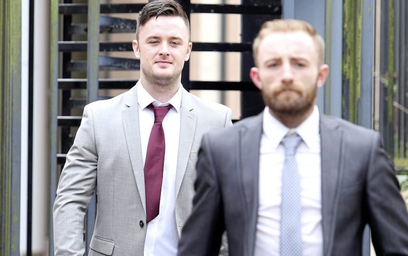 Former Armagh GAA player Robbie Tasker (left) and Antion McCoey leaving Newry Court where they are on trial for kidnapping and robbing a taxi driver and making threats to kill and common assault. Picture Mal McCann.. 