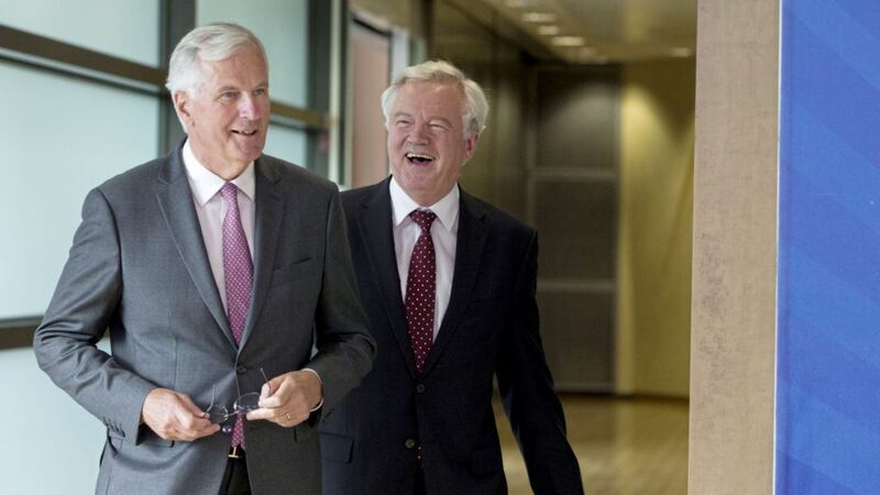European Union chief Brexit negotiator Michel Barnier, left, speaks with British secretary of state David Davis prior to a meeting at EU headquarters in Brussels. The EU and Britain start a third round of Brexit negotiations on Monda PICTURE: Virginia Mayo/AP 
