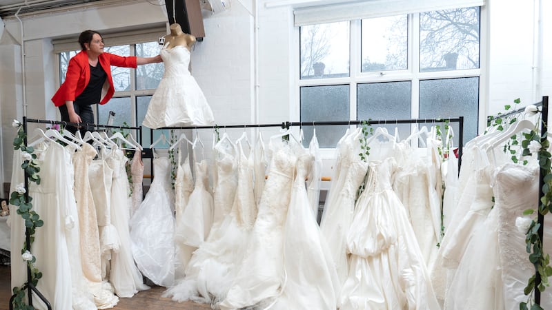 100 wedding dresses were donated to the British Heart Foundation in Sidcup, London, in memory of the late fashion designer who created them