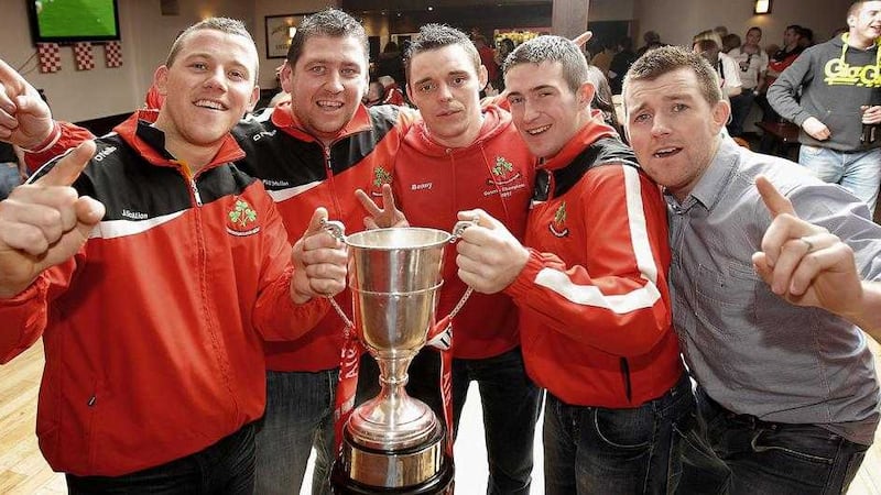 PJ O'Mullan (second left) celebrates with Joey Scullion, Benny McCarry, Eddie McCloskey and Martin Scullion after Loughiel beat Coolderry in the 2012 All-Ireland final