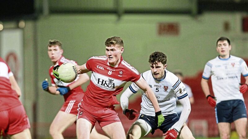 Derry midfielder Jack Doherty takes possession ahead of Ulster University&rsquo;s Rory Brennan during last night&rsquo;s Dr McKenna Cup match at Celtic Park Picture by Margaret McLaughlin 