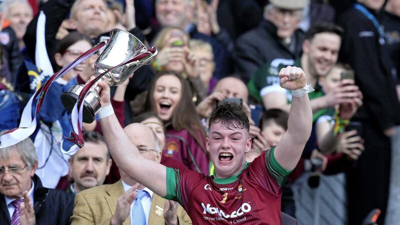 A jubilant Jamie Haughey collects the Hogan Cup for&nbsp; St Ronan's College, Lurgan.<br />Pic Philip Walsh
