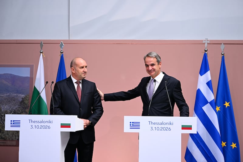 Greek PM Kyriakos Mitsotakis, right, and his Bulgarian counterpart Rumen Radev took part in the handover ceremony (AP)