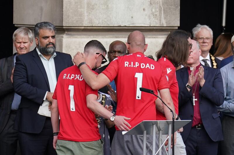 Ian Coates' sons during a vigil in Old Market Square, Nottingham, on Thursday (Tim Goode/PA)