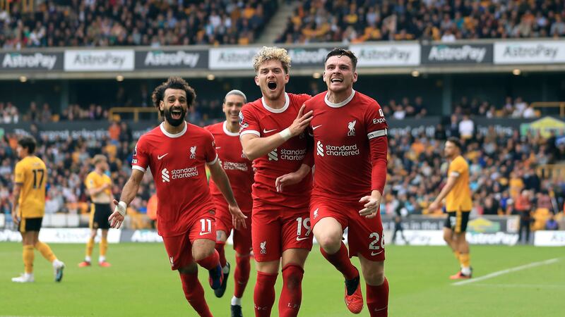 Liverpool’s Andrew Robertson (right) celebrates his goal at Wolves (Bradley Collyer/PA)