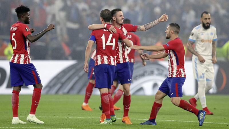 Atletico Madrid players celebrate victory over Marseille in Lyon 