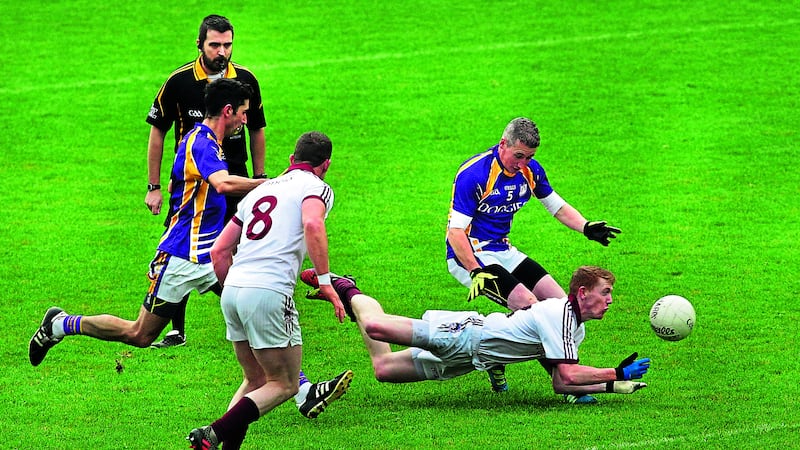 Slaughtneil&rsquo;s Christopher Bradley gets his pass away despite hitting the ground during yesterday&rsquo;s Ulster Club SFC&nbsp;