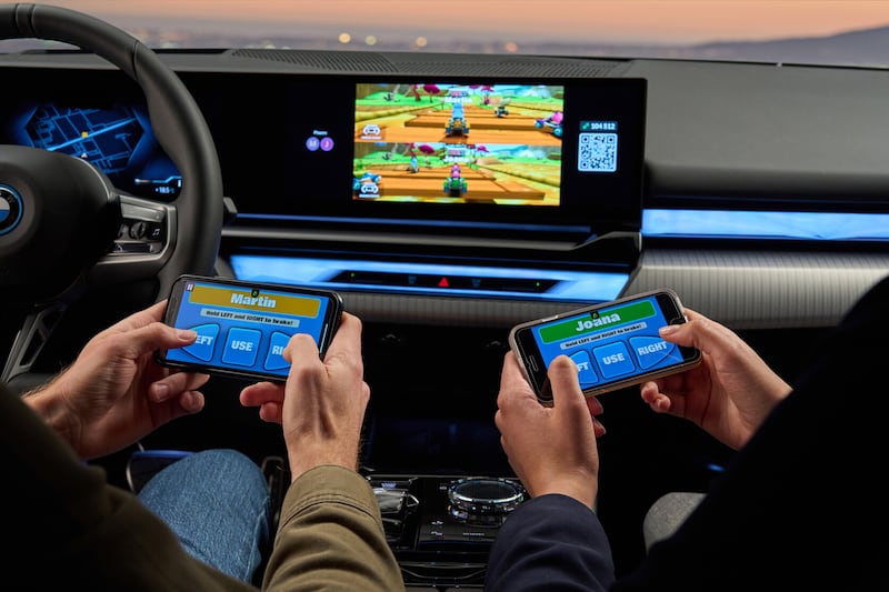 Do buyers of expensive luxury saloons really want to play games in their cars?