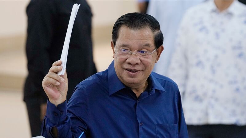 Cambodian Prime Minister Hun Sen has said he will step down in three weeks’ time and hand the position to his oldest son (Heng Sinith/AP)