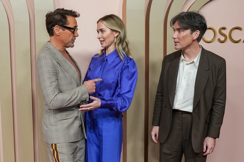 Robert Downey Jr with Emily Blunt and Cillian Murphy at the 96th Academy Awards Oscar nominees luncheon (Jordan Strauss/AP)