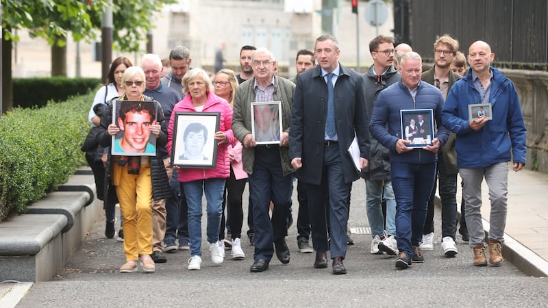 Relatives of Phelim McNally, Tommy Casey, Sean Anderson, Dwayne O'Donnell and Thomas Armstrong arrive at the High Court in Belfast. Picture by Mal McCann.